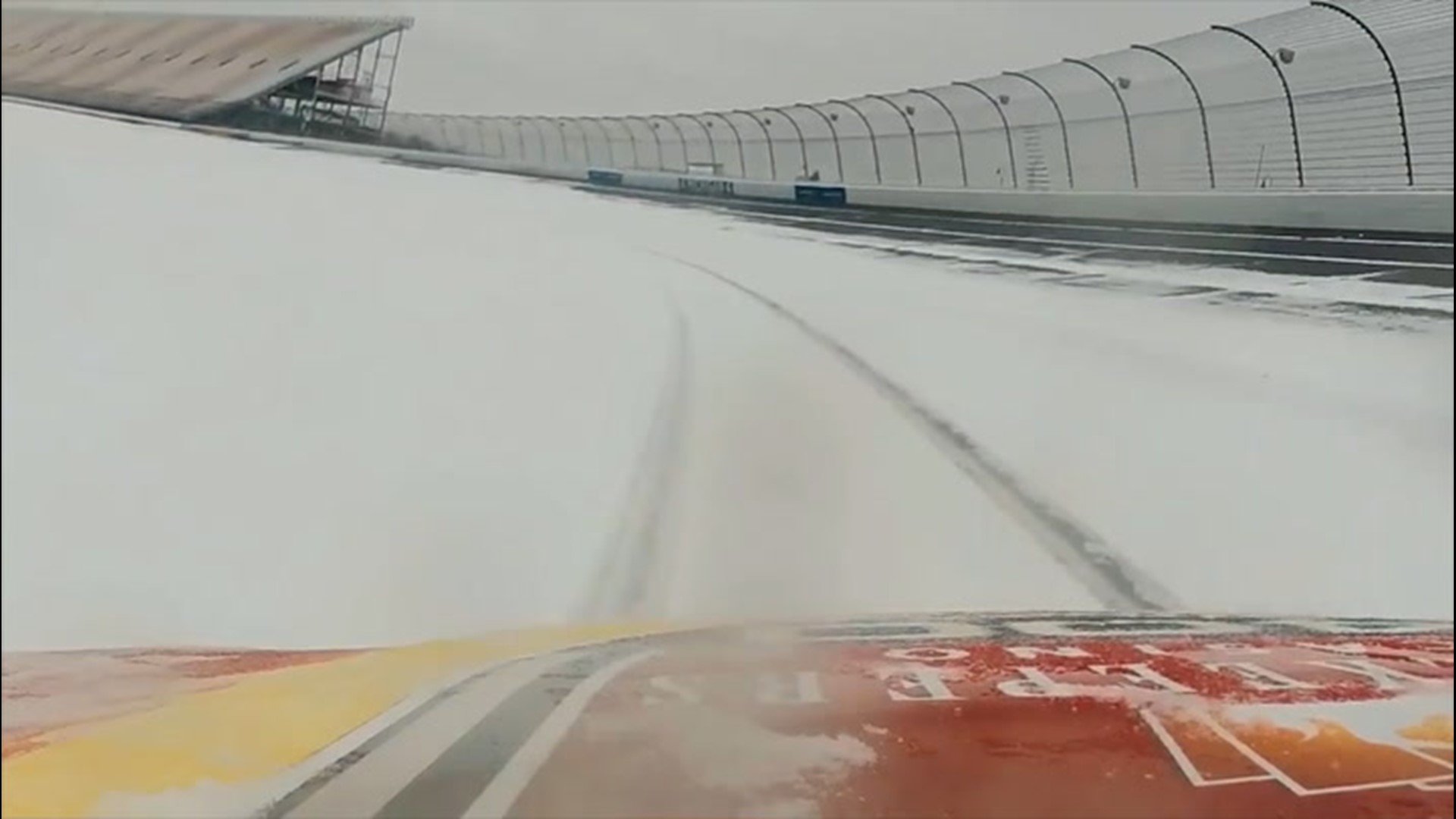 A racing car took a few laps around a snowy Michigan International Speedway in Brooklyn, Michigan, on Feb. 26.