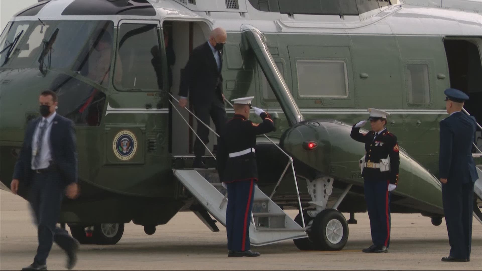 The president brushed a cicada from his shoulder as he chatted up his traveling press corps before he boarded Air Force One for the flight to Europe.