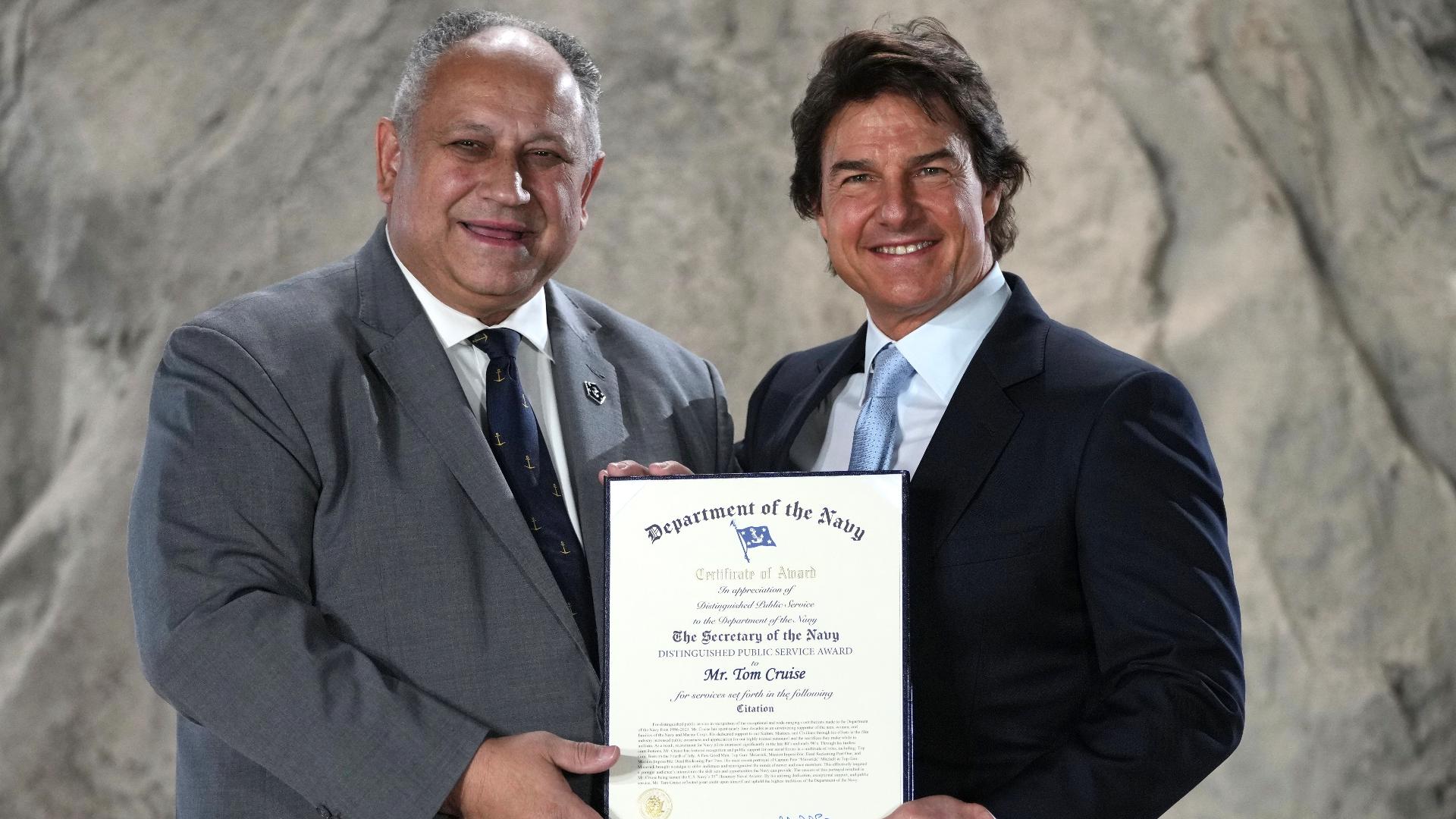 Tom Cruise receives a Navy Distinguished Public Service Award from United States Secretary of the Navy, Carlos Del Toro. (Dec. 17, 2024)