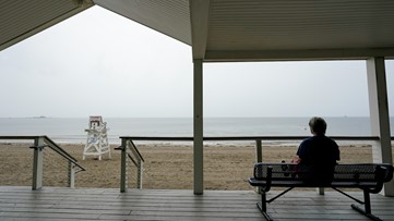 Moving inland, Tropical Storm Henri drenches Northeast