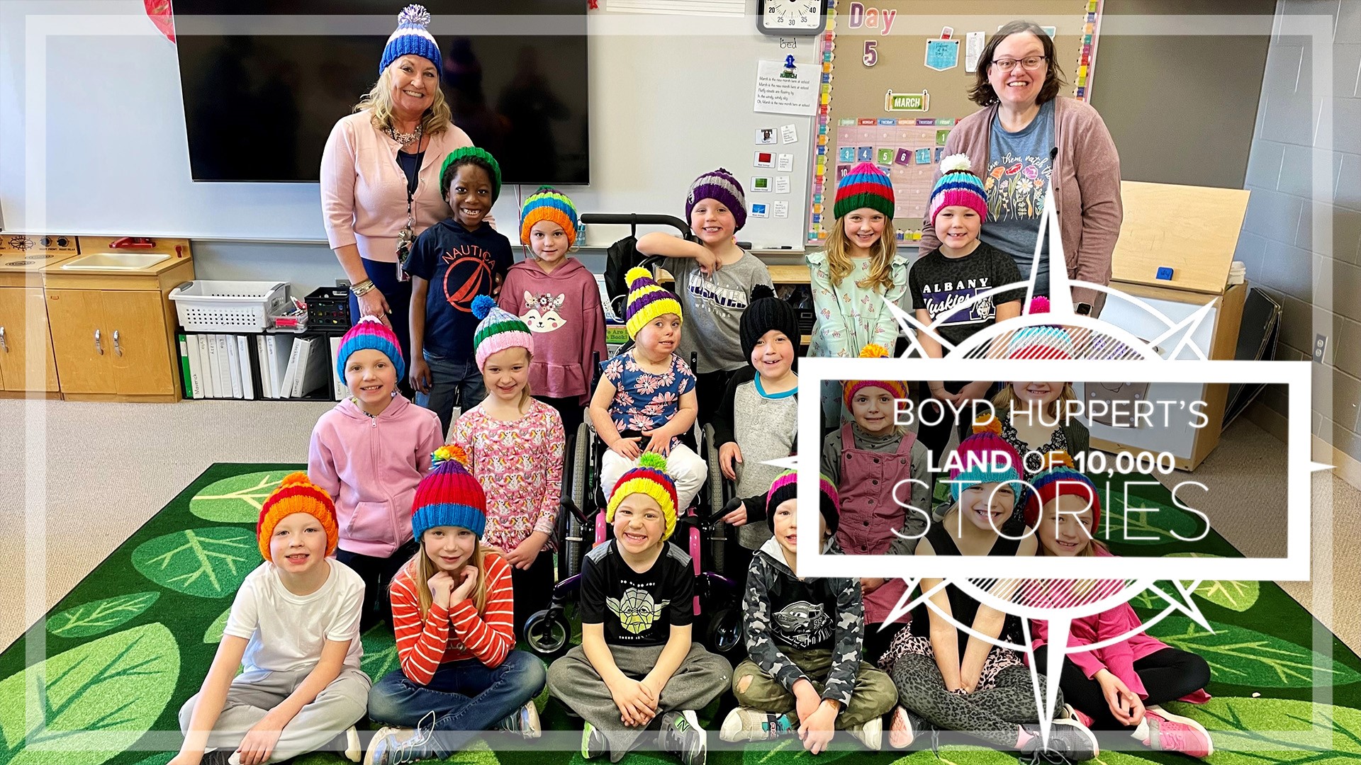 To surprise her class, Jody Abraham spent six weeks knitting 18 hats.