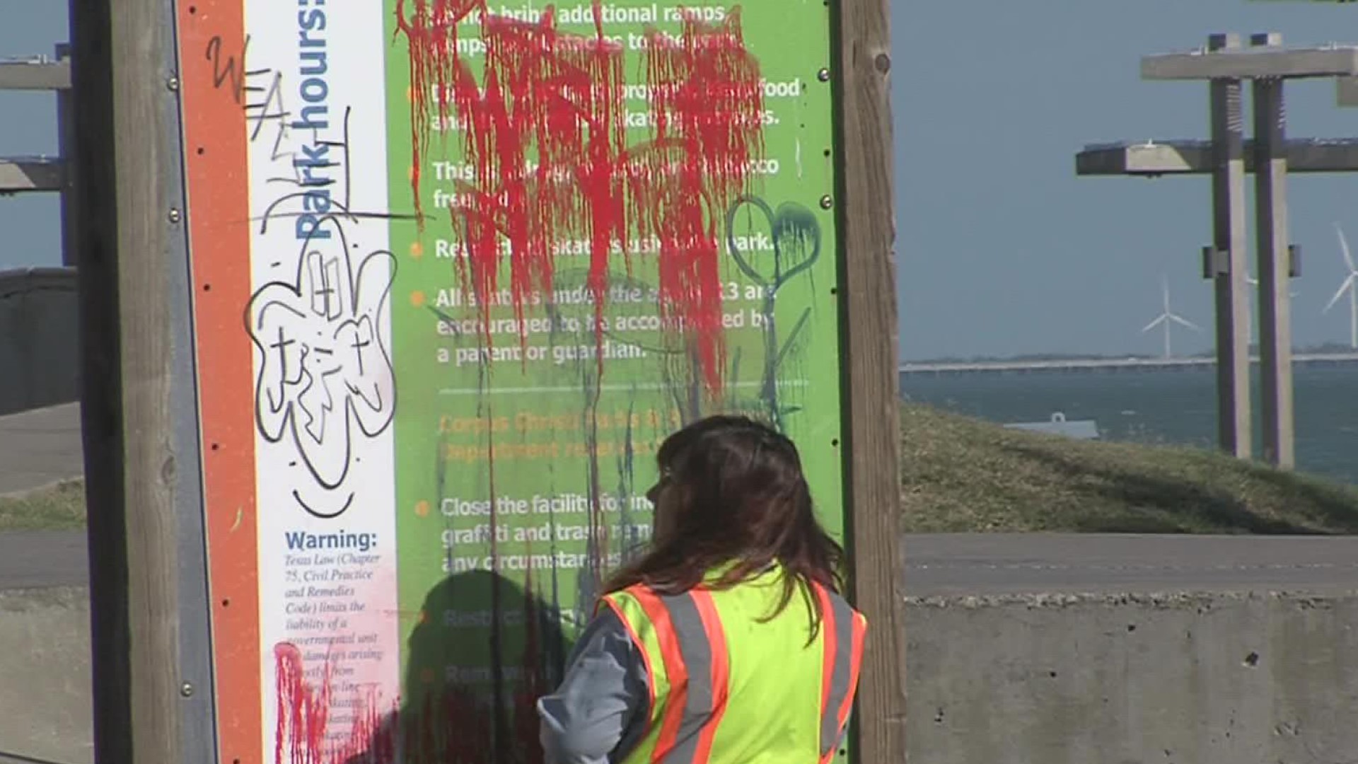 Pictures show red spray paint on three different sections of the new pier.