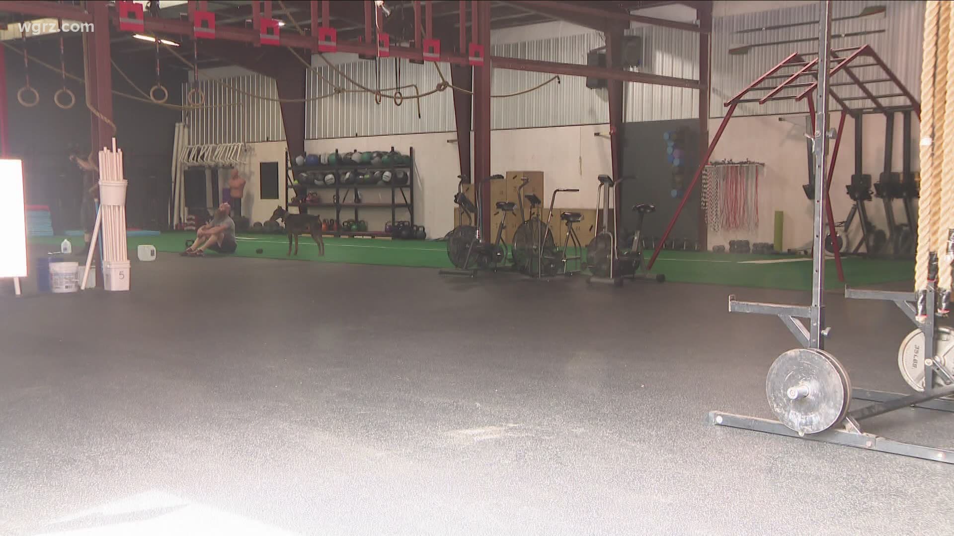 The Orchard Park gym that's been protesting the new state COVID restrictions will not reopen tomorrow as previously planned, that's according to a report by WBEN.