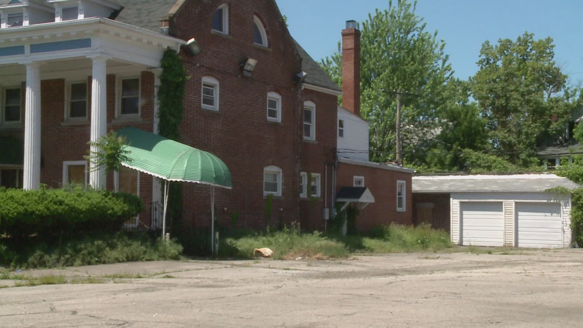 The body, identified as 53-year-old Dwayne Hundley of Garfield Heights, was found behind an abandoned funeral home at 15357 Euclid Avenue.