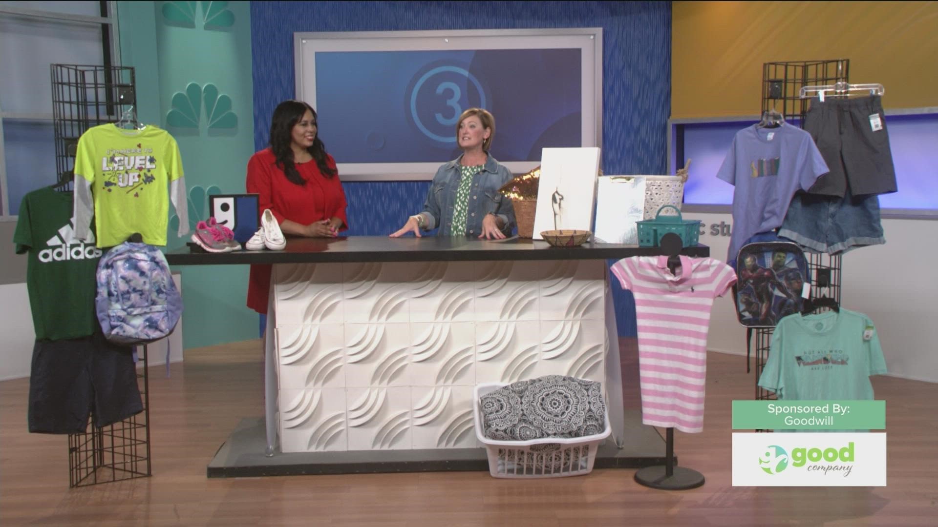 Maureen Ater, Vice President of Marketing & Development for Goodwill, shows Ciarra some items you can find there, just in time for the back to school season.