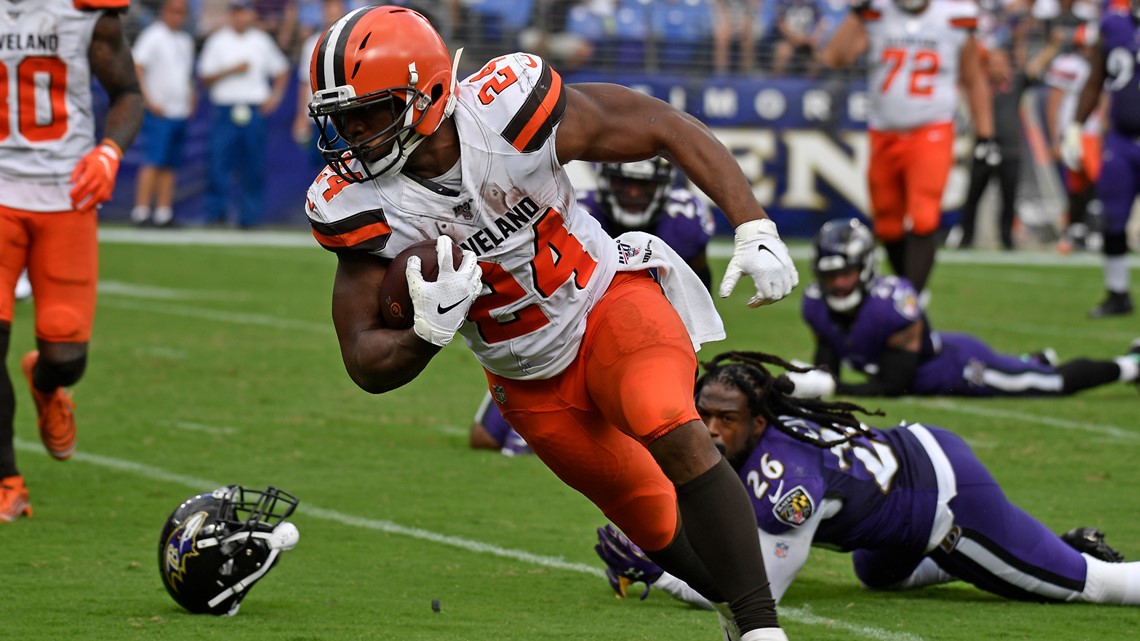 Cleveland Browns running back Nick Chubb (24) rushes at Buffalo Bills free  safety Jordan Poyer (21) and strong safety Micah Hyde (23) during an NFL  game on Sunday, Nov. 10, 2019 in