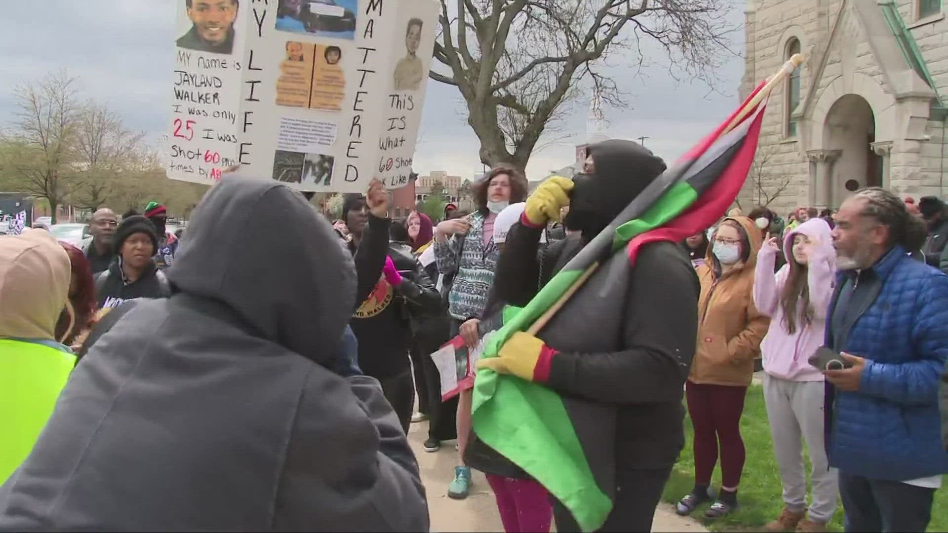 Community members held a prayer vigil outside of Akron's Justice Center on Tuesday.