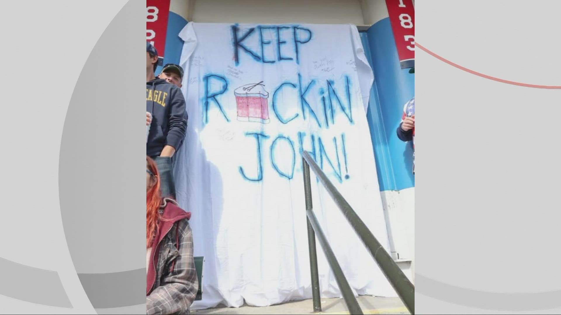 Drummer John Adams was honored with a sign at Cleveland Guardians playoff game on Saturday against the Tampa Bay Rays.