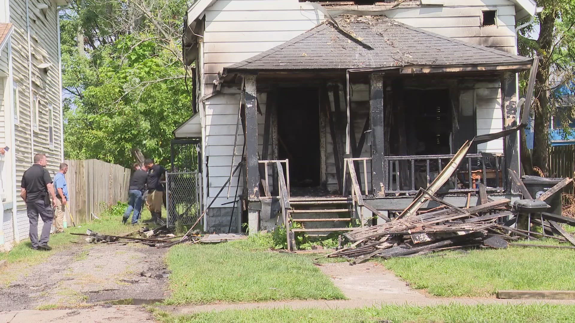 The Cleveland Division of Fire also reports that a woman had leapt from the second floor porch.