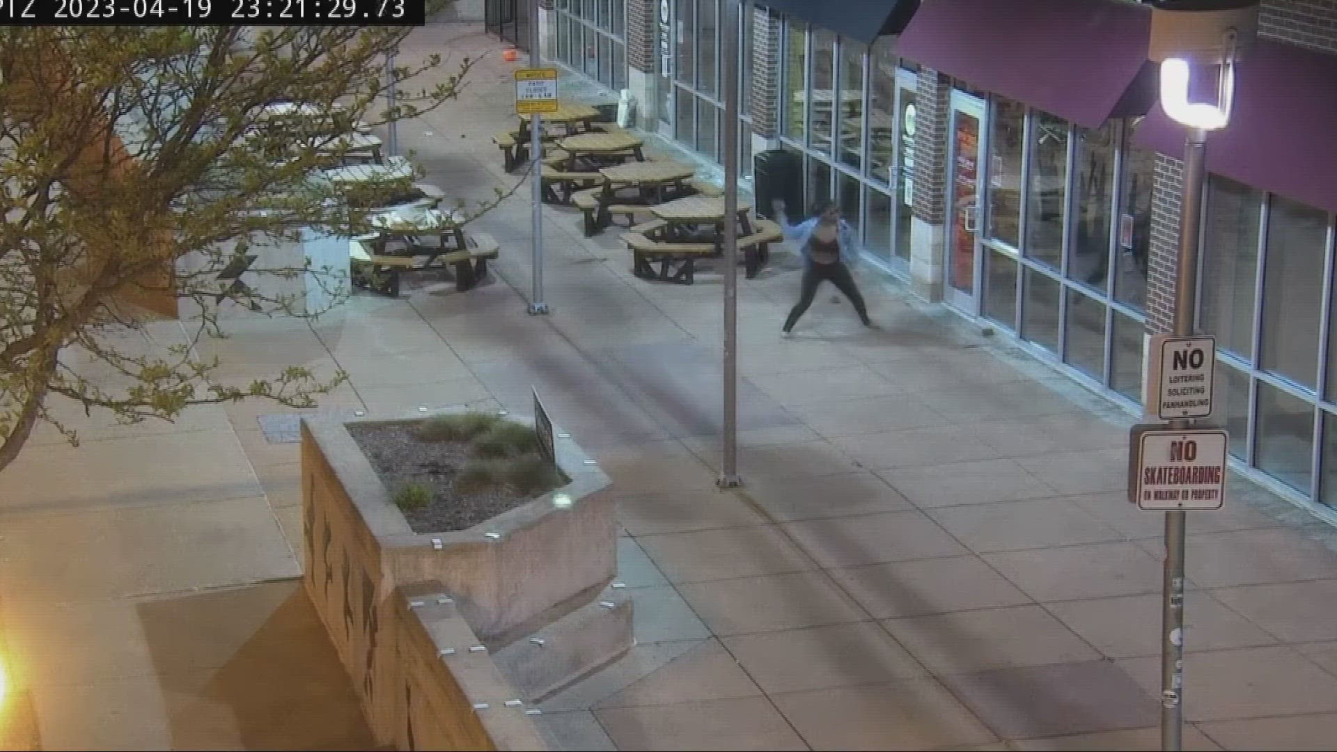 A protester can be seen throwing an object through the window of an Akron business in the footage.