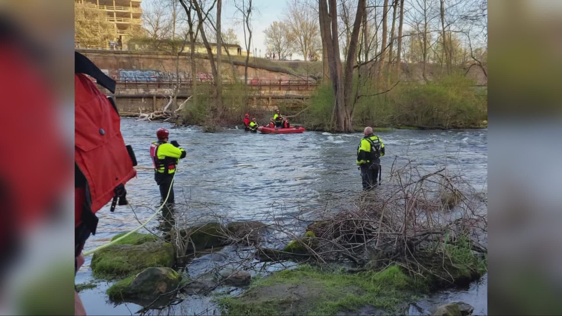 Officials say a kayaker had heard shouts for help when he spotted two people struggling in the water just south of the Main Street bridge in Kent.