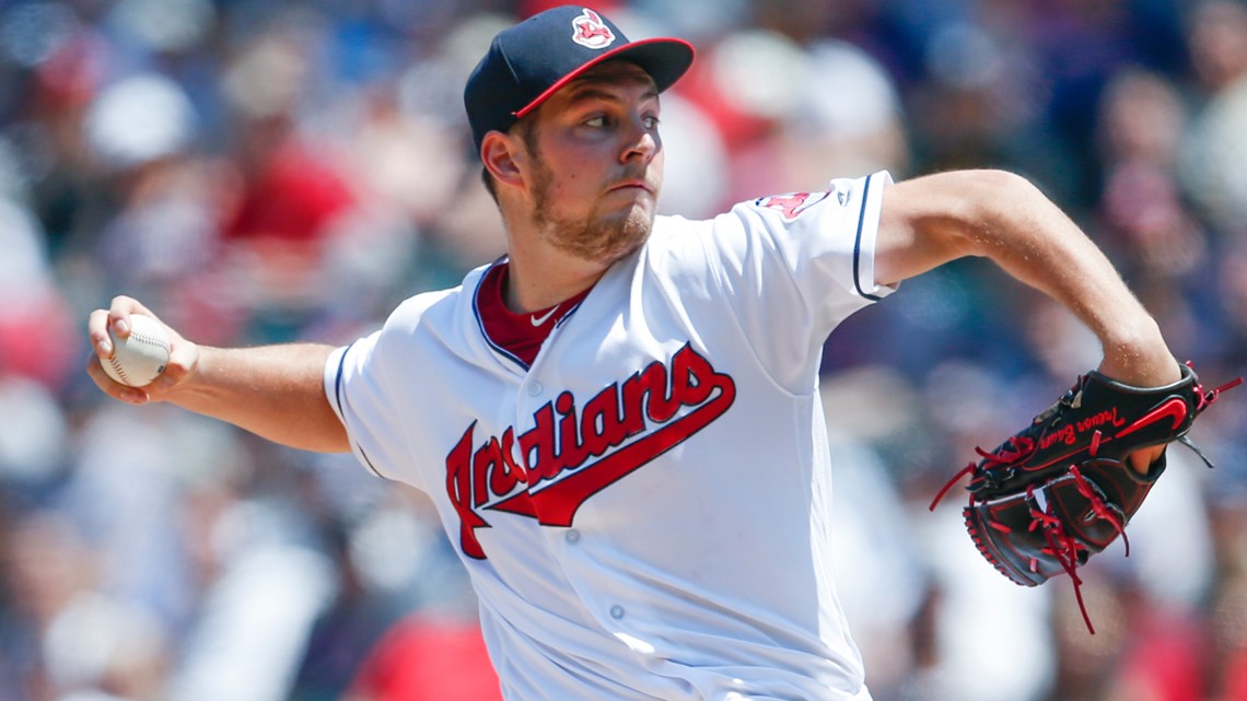 Cleveland Indians Trevor Bauer adorns a baseball with hair made