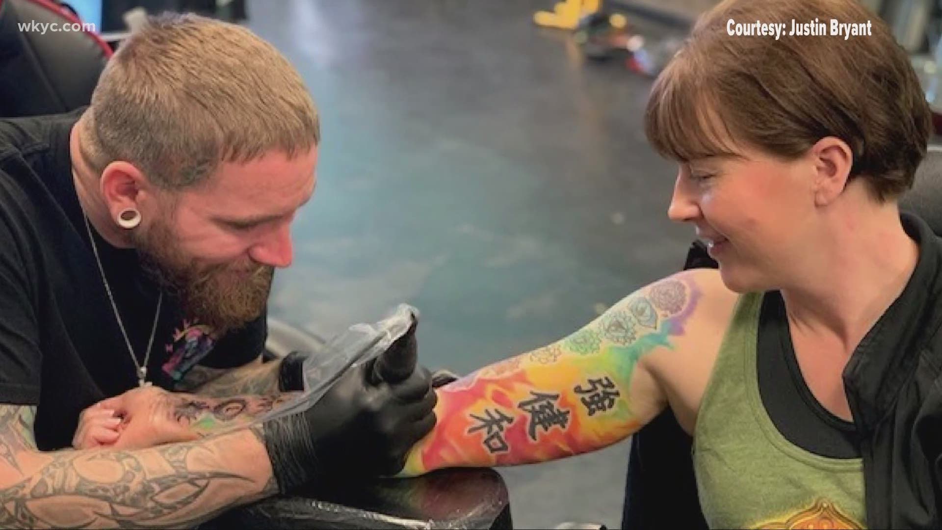 Third generation tattoo artist celebrates shop reopening