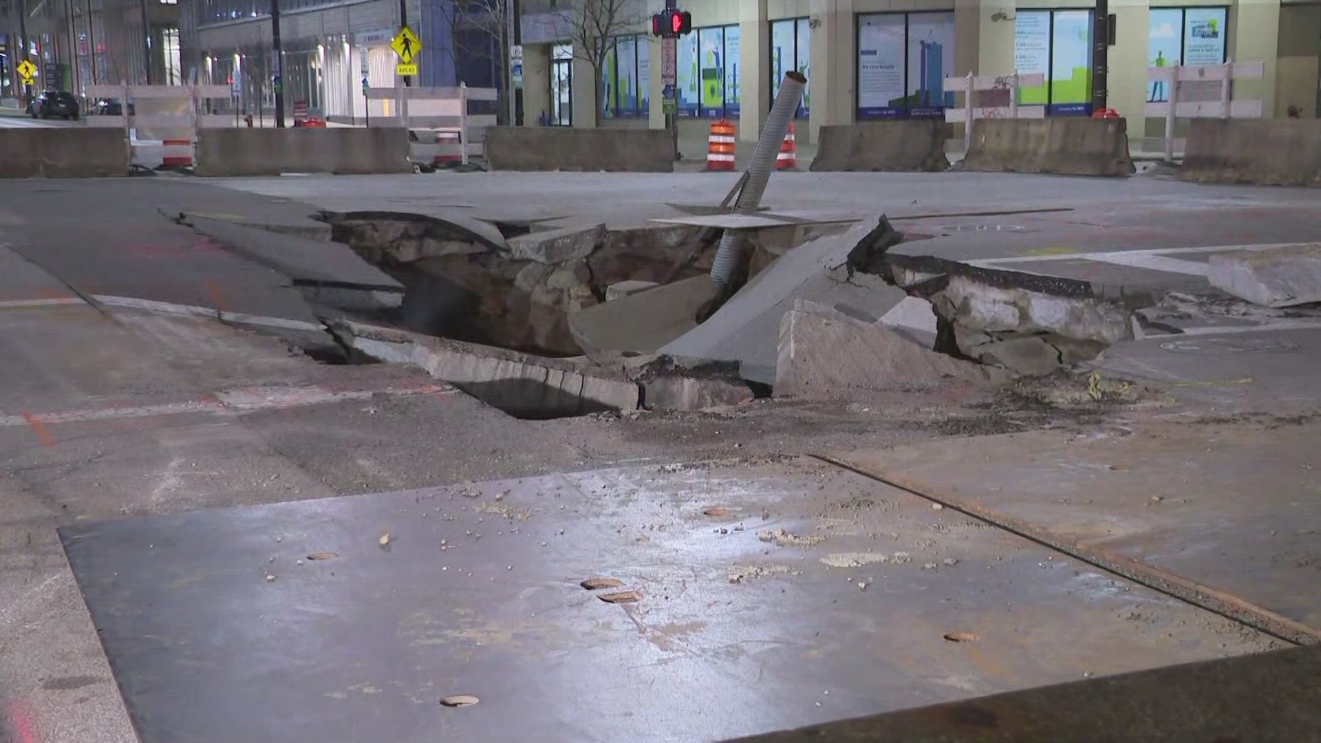 No injuries after car pulled from large sinkhole in downtown