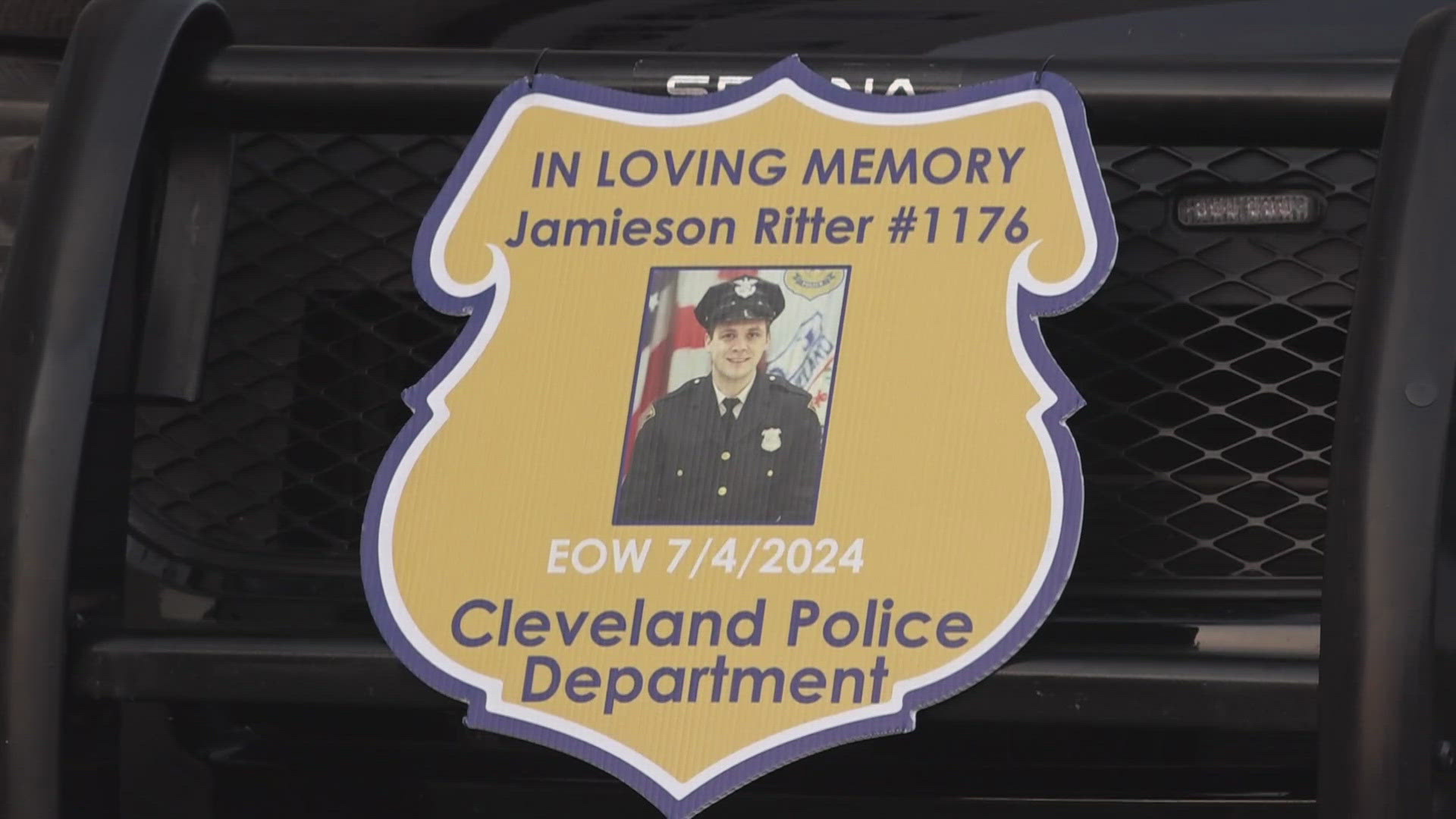 Family, friends, and fellow officers gathered for a candlelight vigil Thursday outside Cleveland's Third District Police Headquarters.