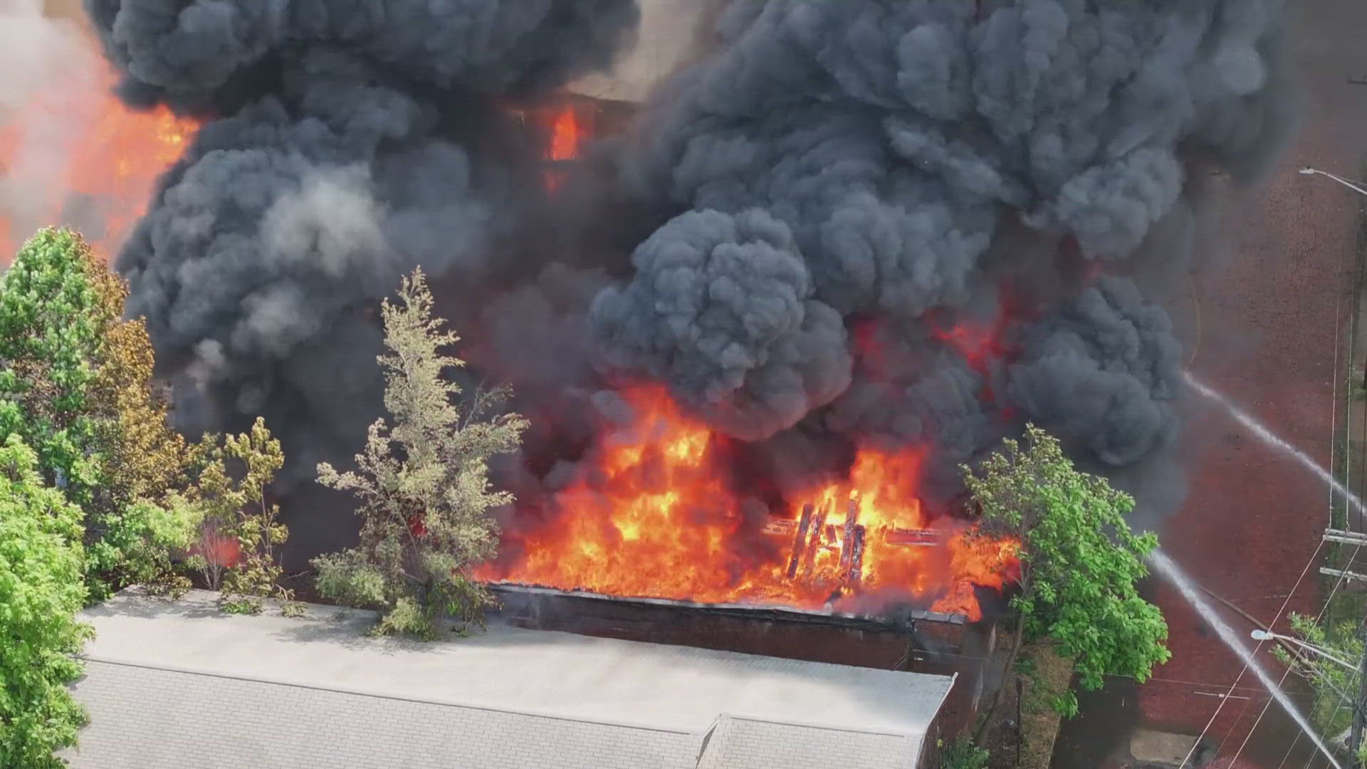 Firefighters from 28 companies responded to the blaze at East 65th and Selma Avenue. The fire impacted a nearby house, damaging one side. No injuries were reported.