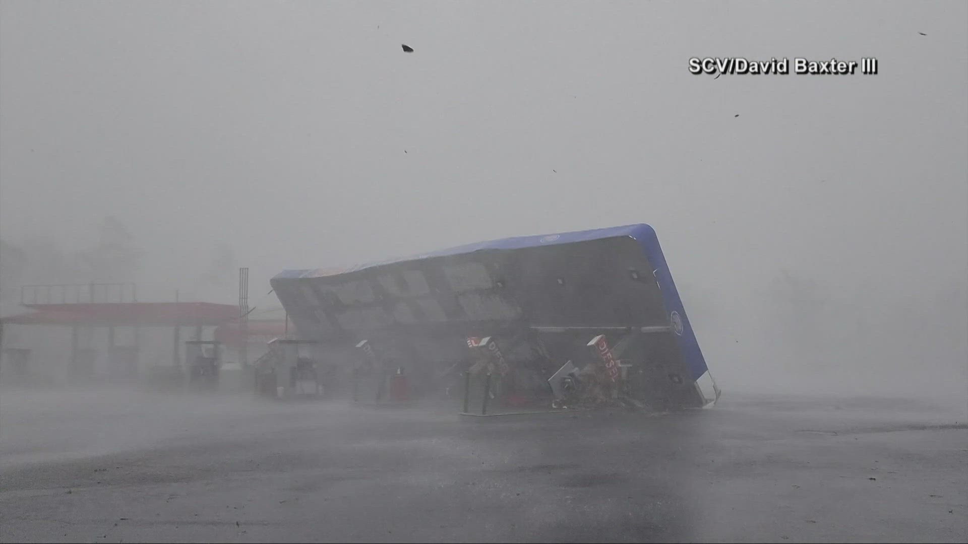 The storm slammed into Florida, ripped roofs off hotels and turned small cars into boats before sweeping into Georgia.