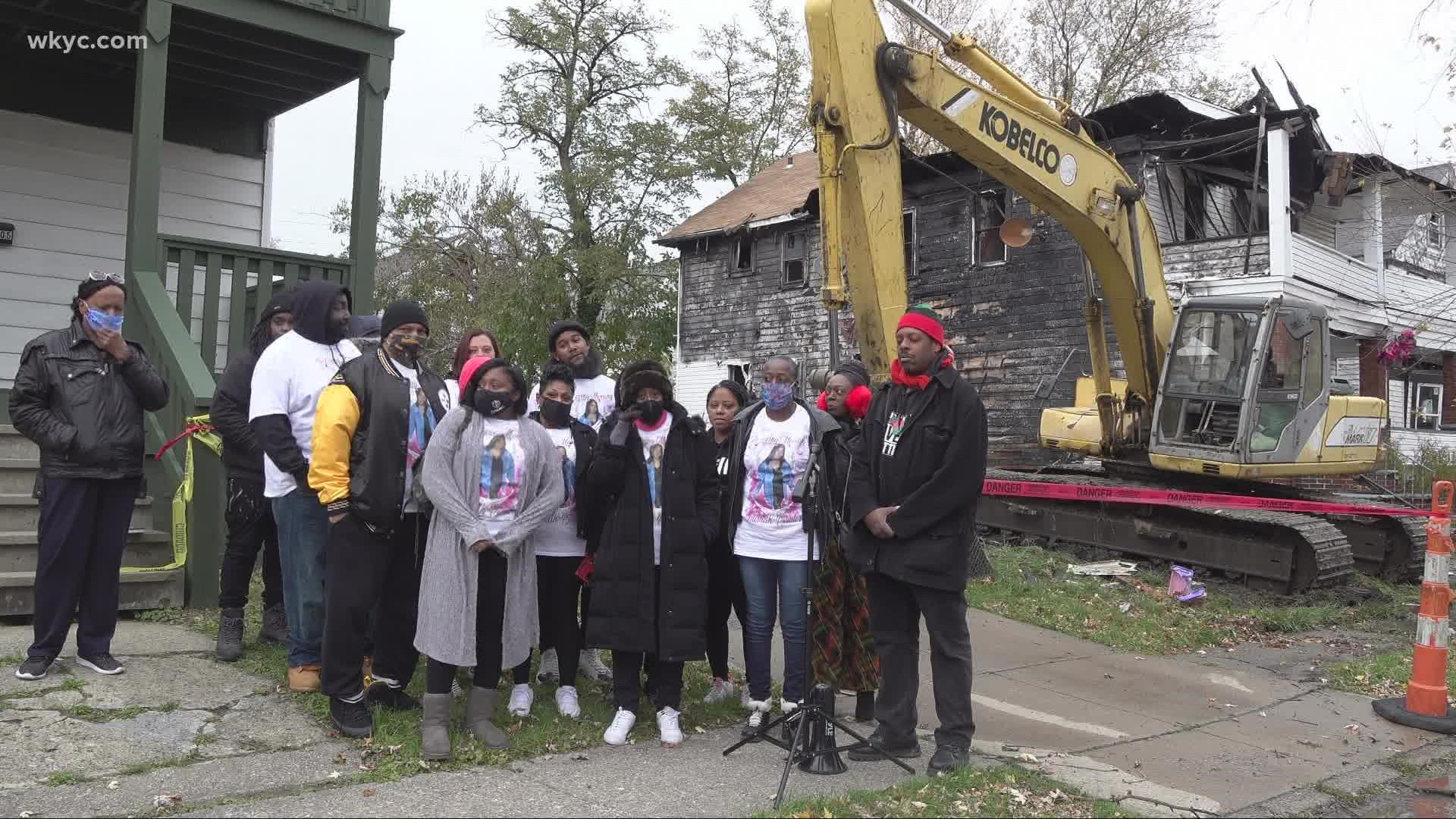 The home on Savannah Avenue where Pointer's body was demolished today as family and friends of Pointer's watched.