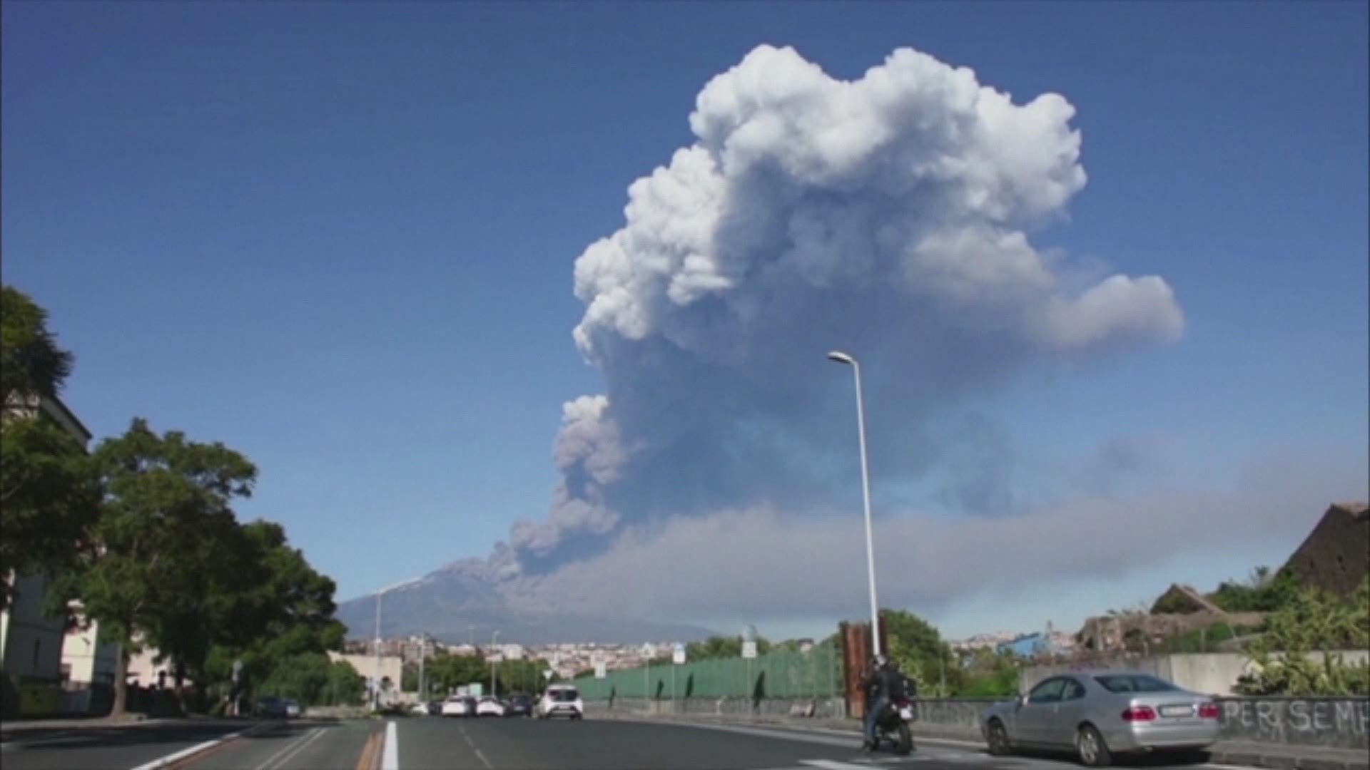 The Mount Etna observatory says lava and ash are spewing from a new fracture on the active Sicilian volcano amid an unusually high level of seismic activity.