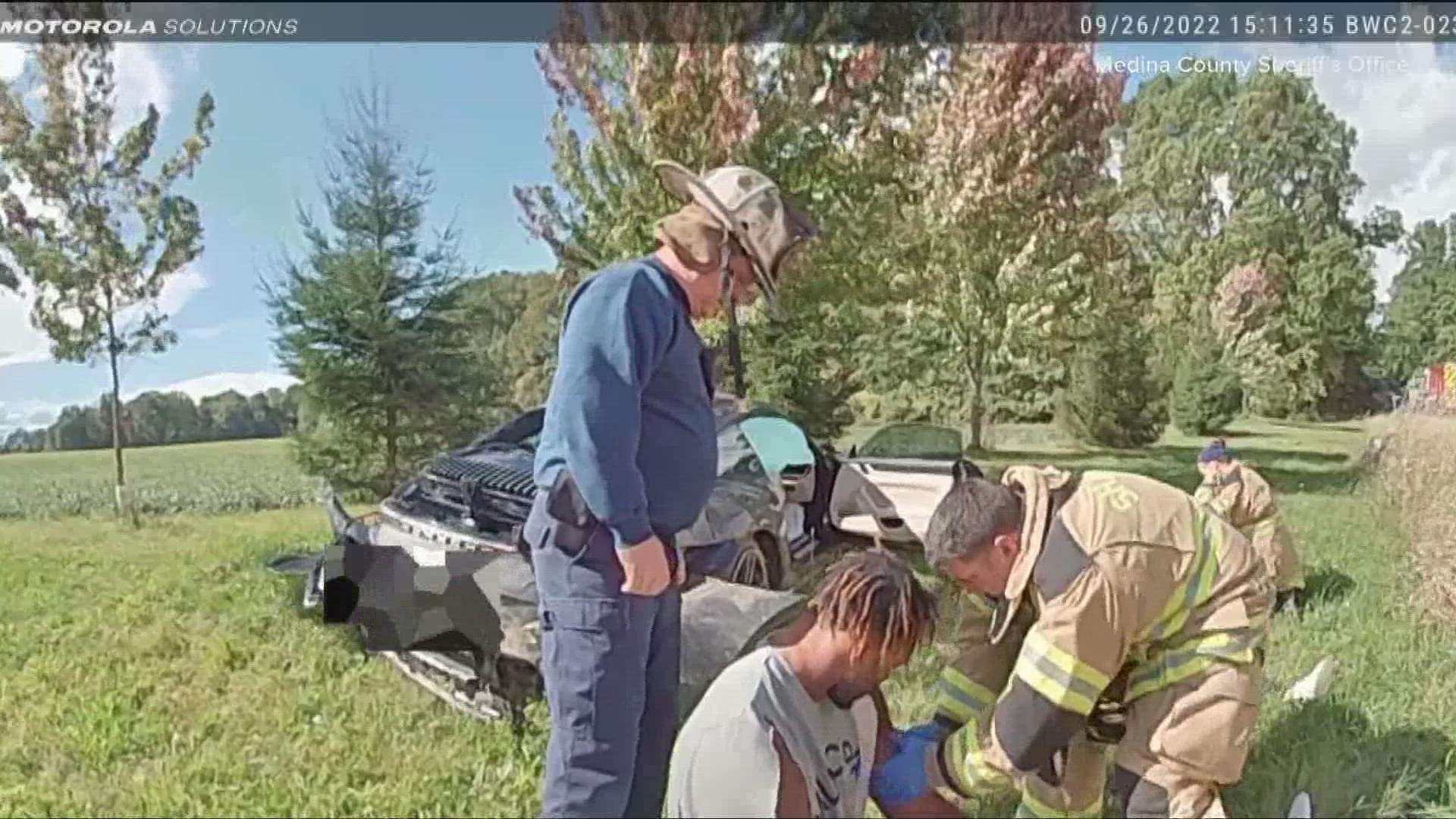 In the footage, first responders help Garrett to his feet while blood gushes from his right hand. His female passenger was also hurt and lying on the ground.