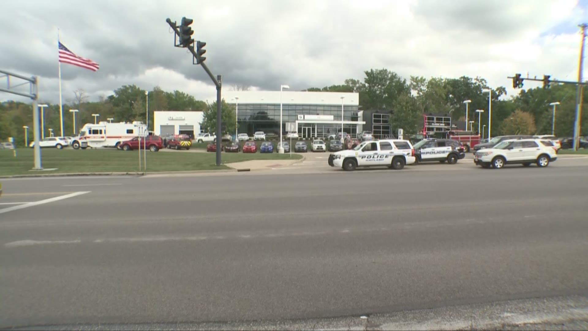2 police officers shot at Willoughby Hills car dealership photos