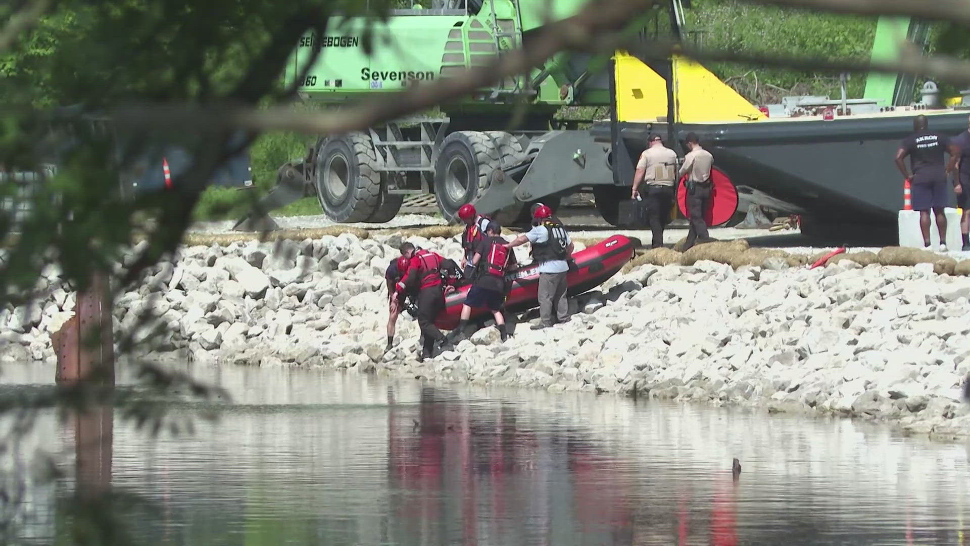 The search began shortly before 7 p.m. Saturday, following reports that a man and his 5-year-old son "had gone under the water" while on an inflatable inner tube.
