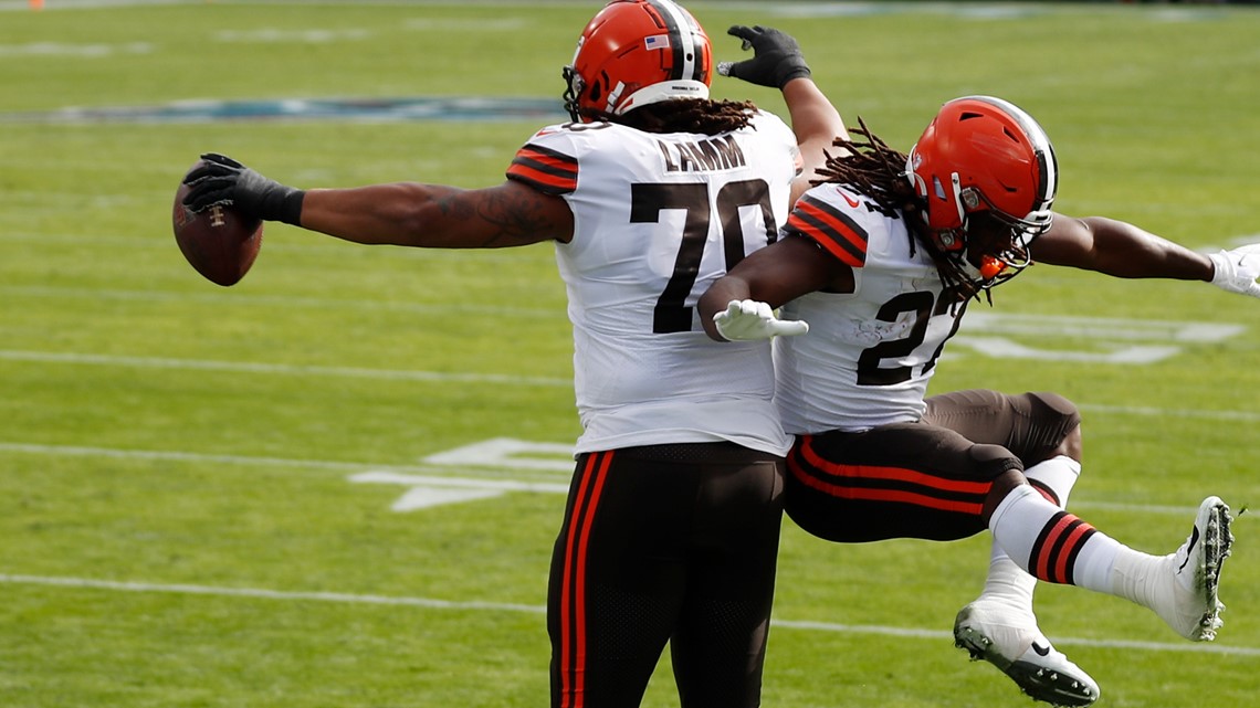 Cleveland Browns offensive tackle Kendall Lamm (70) is escorted to the  locker room after getting injured during the second half of an NFL  divisional round football game against the Kansas City Chiefs