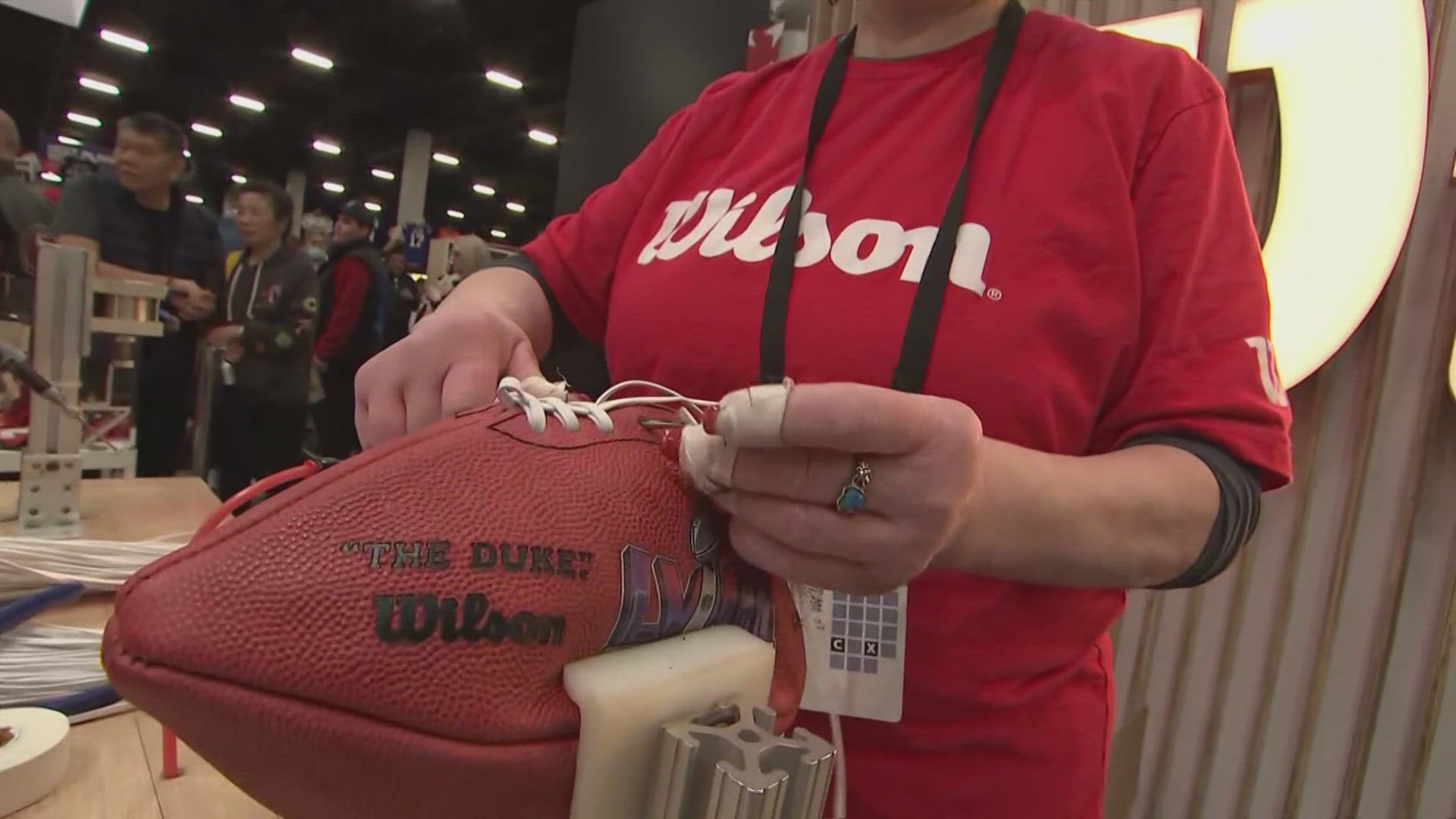 Wilson shows how NFL footballs are made ahead of the Super Bowl in Las Vegas.