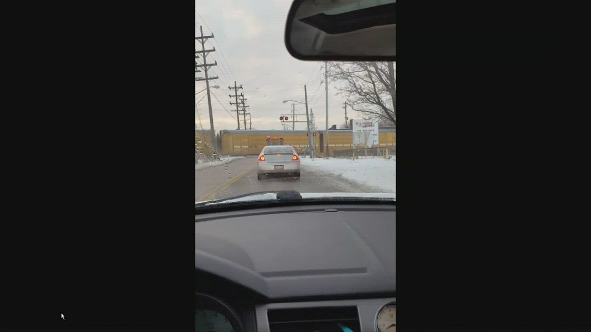 Jan. 17, 2018: Video sent to WKYC this morning shows a school bus stuck underneath a railroad crossing gate as a train speeds by. The woman who recorded the footage tells WKYC there were students on board the bus, which she spotted stuck under the gate on