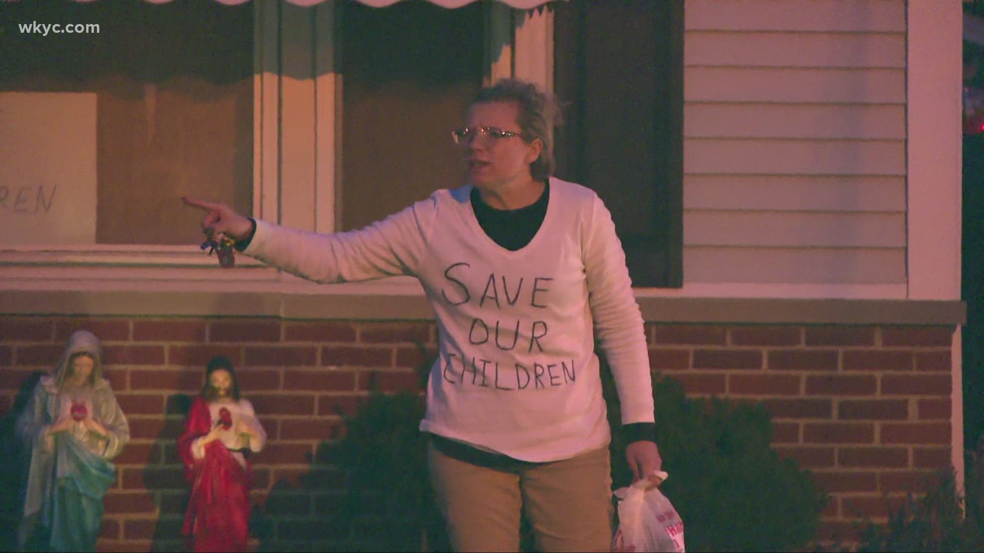 Christine Priola returned to her Willoughby home after posting $20,000 bail. She was seen wearing a shirt that said "Save the children."