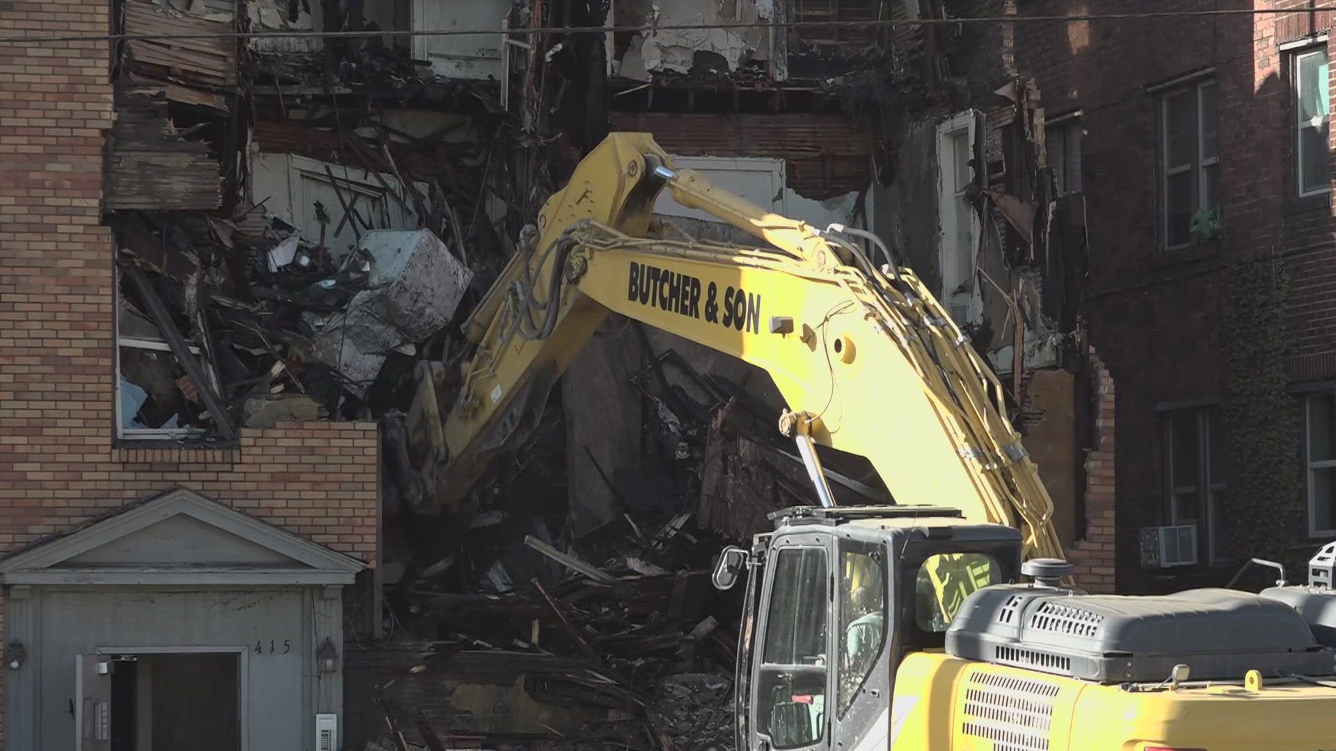 Firefighters rescued four victims, one seriously injured, from a fire at a Canton apartment building Sunday morning. The fire remains active, officials say.