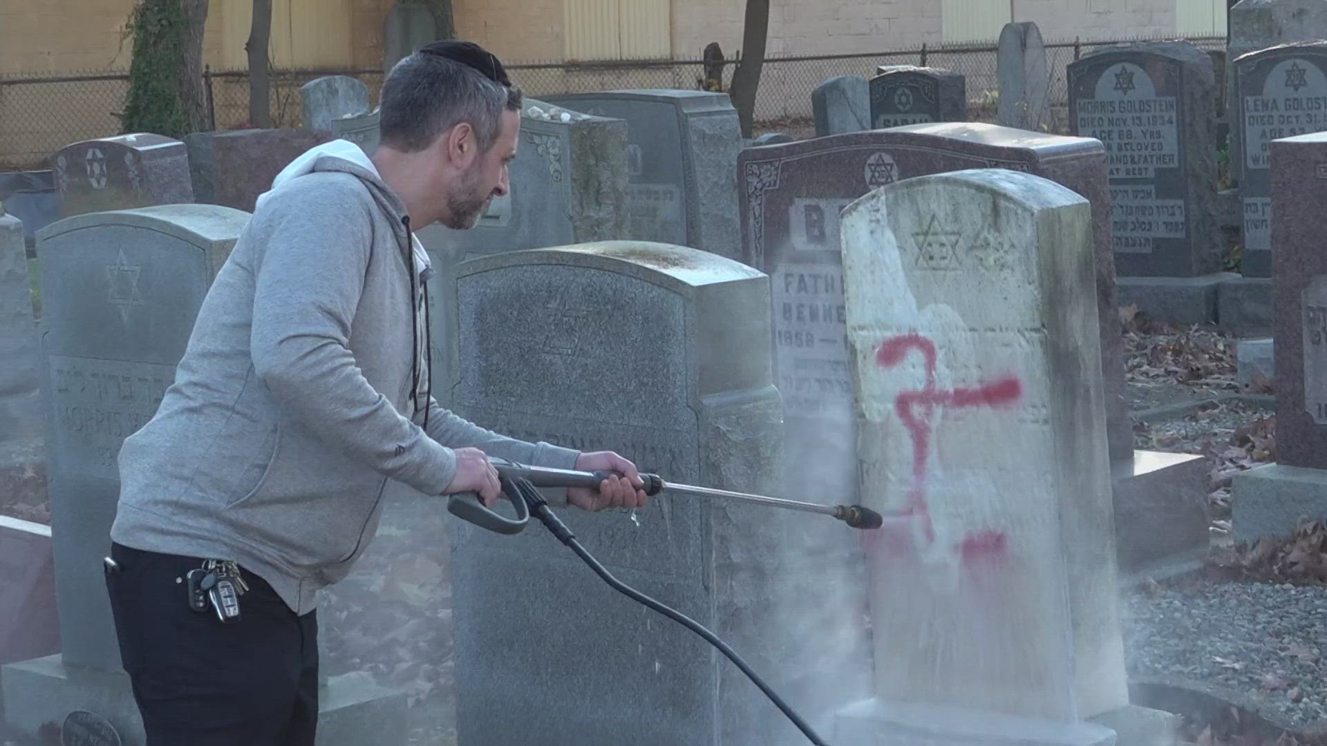Multiple rows of headstones were vandalized with the antisemetic symbol.