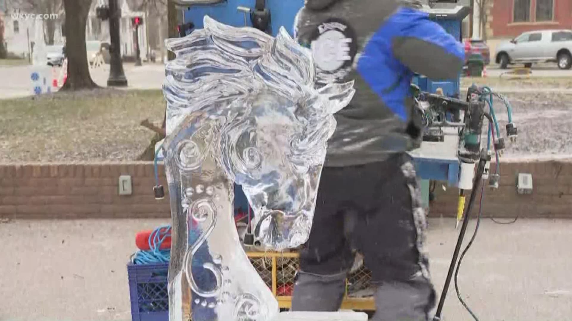 Lindsay helps add finishing touches to an ice sculpture at the Medina Ice Festival
