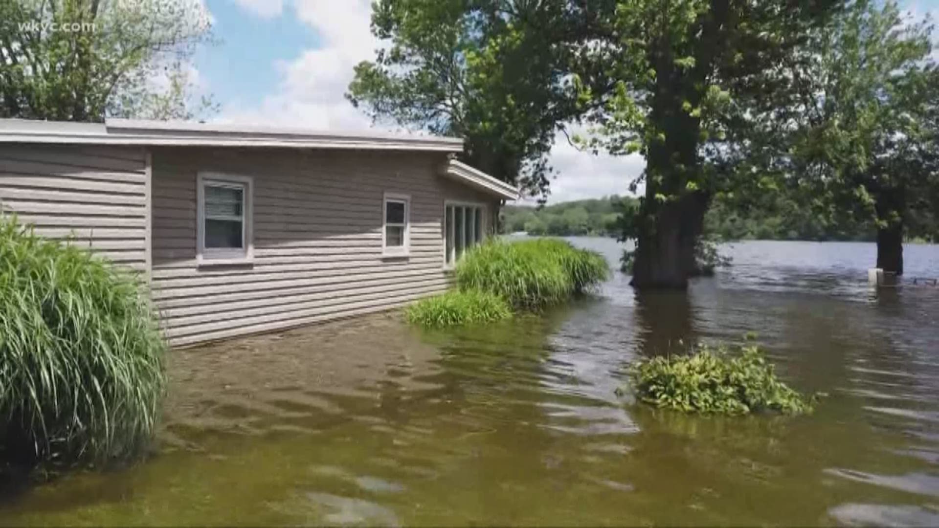 Residents of Luna Lake are still using boats to get through the floodwaters. In some areas, as much as five feet deep.