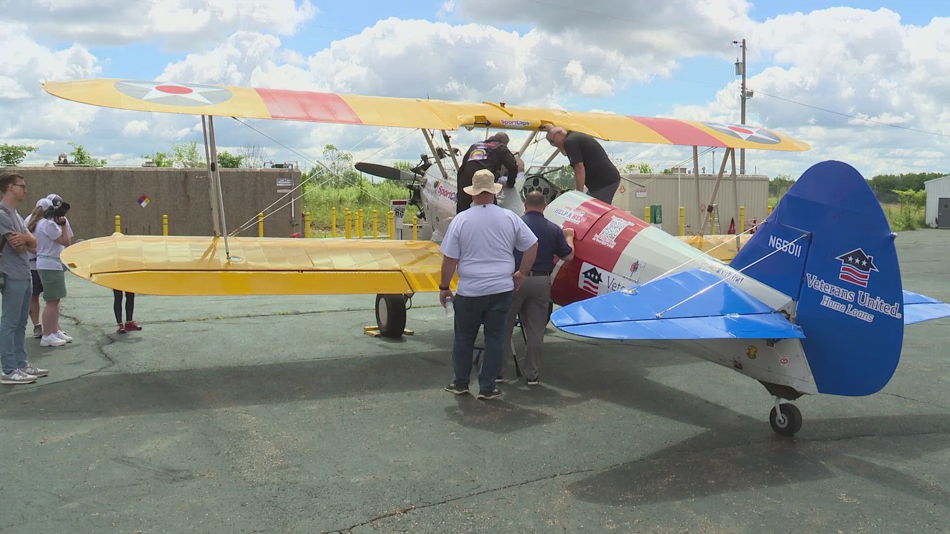 The veterans, ranging in age from 75 to 98, climbed aboard a restored World War II Boeing-Stearman biplane for their flights. Lindsay Buckingham reports.
