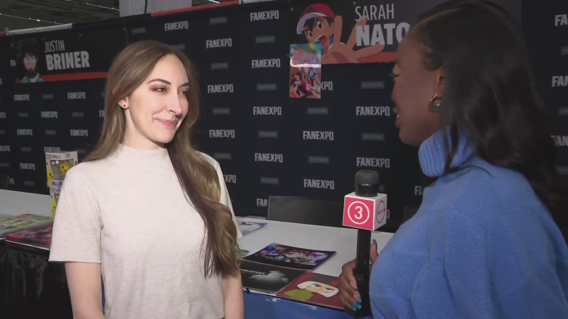 Sarah Natochenny, English language voice of protagonist Ash Ketchum from the "Pokémon" series, joins 3News' Kierra Cotton from Fan Expo Cleveland 2024