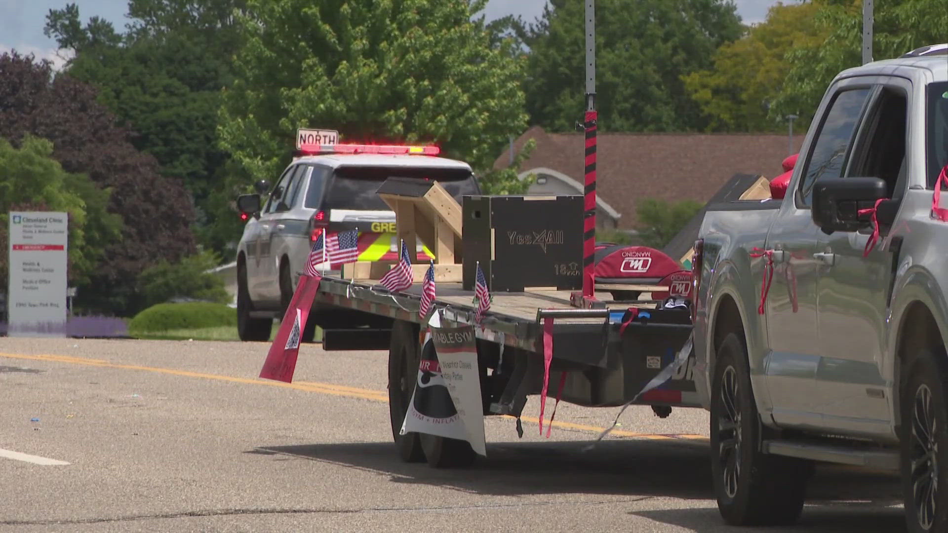 Authorities say the child fell from the front of a parade trailer being pulled by a pickup truck.