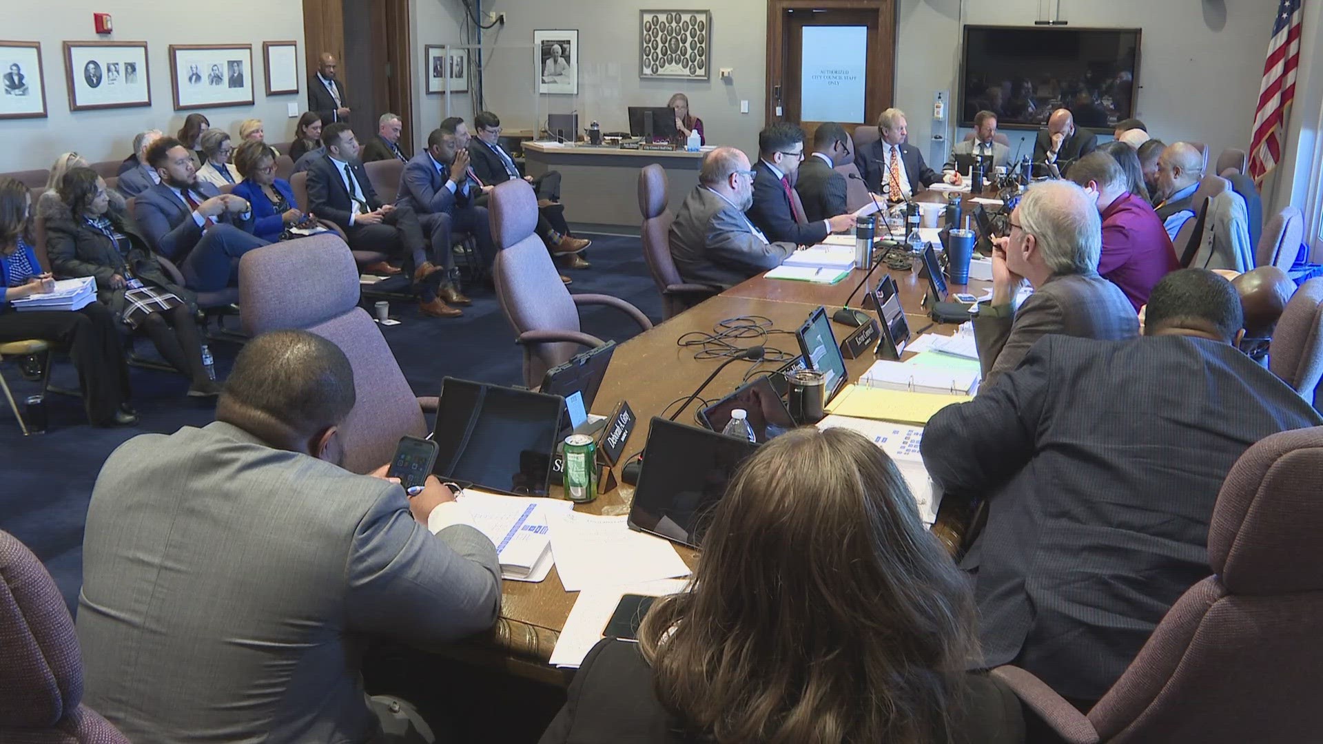 Mayor Justin Bibb's proposal calls for less budgeted police positions, but some councilmembers are accusing him of 'waving the white flag' in hiring more officers.