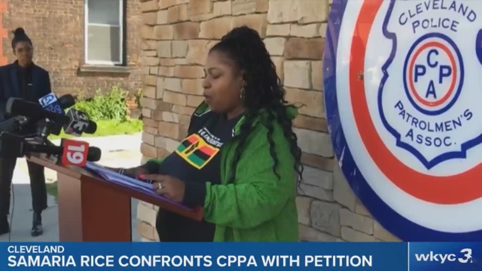Samaria Rice, the mother of Tamir Rice, delivers petitions opposing the rehiring of the police officer who shot and killed her son in 2014.