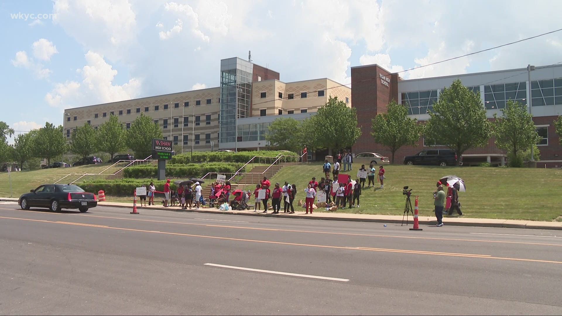 About 50 people showed up at the high school in East Cleveland to protest that Wilson is no longer on the job.
