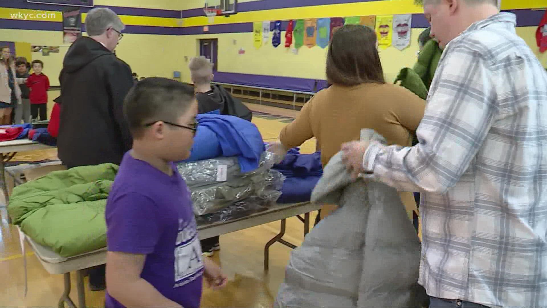 The charity began its annual distribution to schools with more coats than usual this year, and without one of its most notable figures.