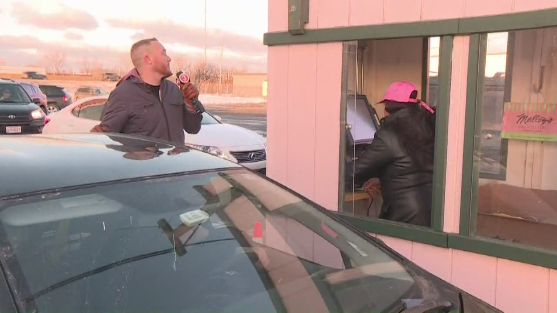 Some procrastinators are waiting until the last minute to get their loved ones a gift. Mike Polk Jr. checks out the drive-thru at Malley's.