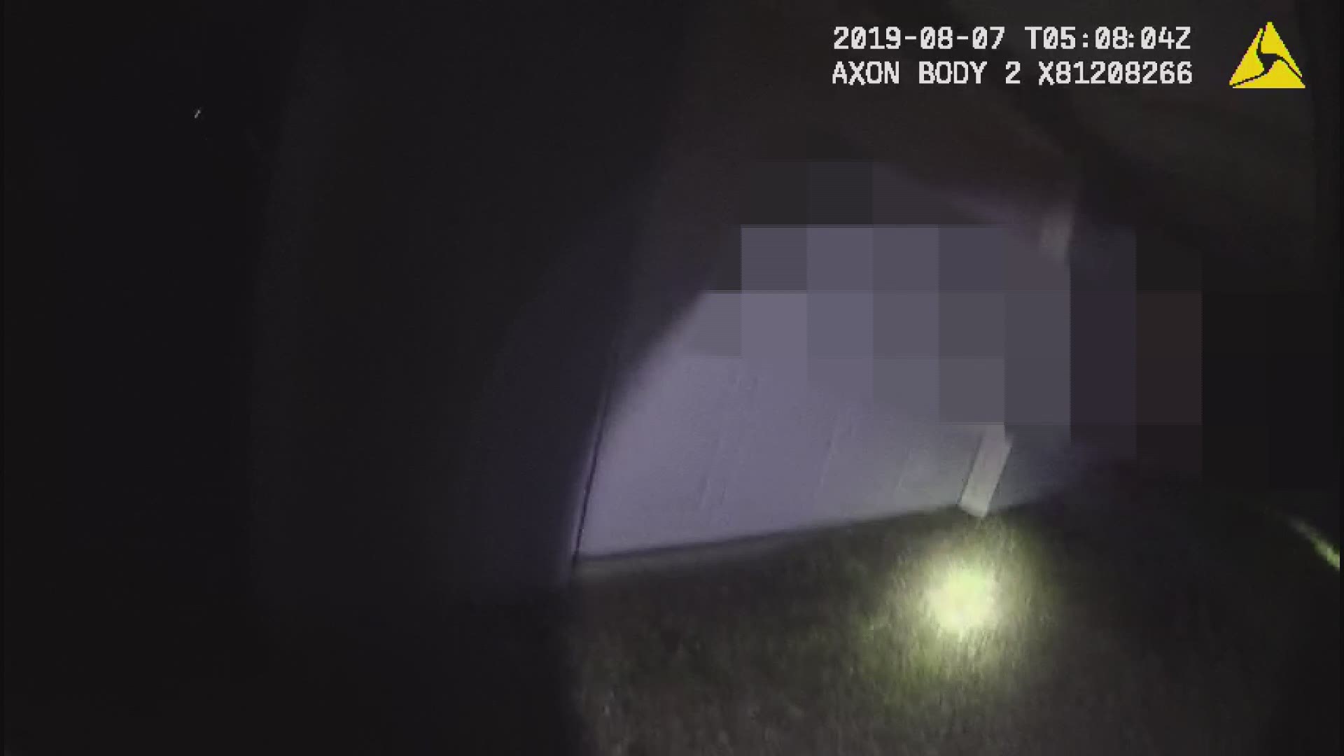 Bodycam video shows Wayne County Sheriff's Deputies inspecting the garage area of the Sterling home where the explosion took place. The graffitti of the swastika and racial slurs has been blurred out.