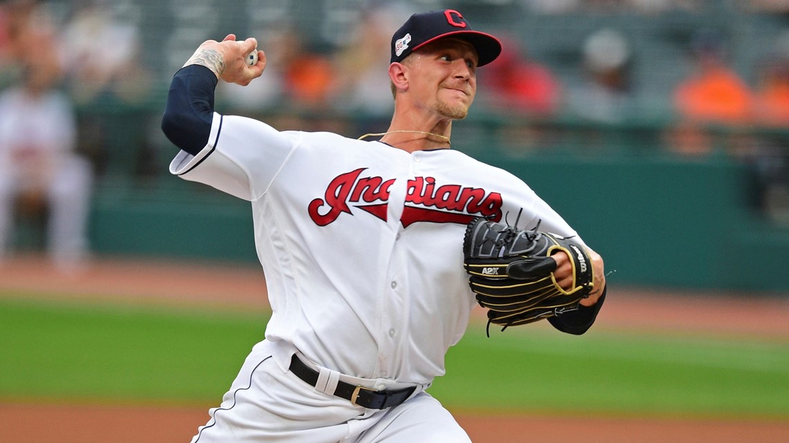 Cleveland Indians pitcher Zach Plesac catches the ball at first