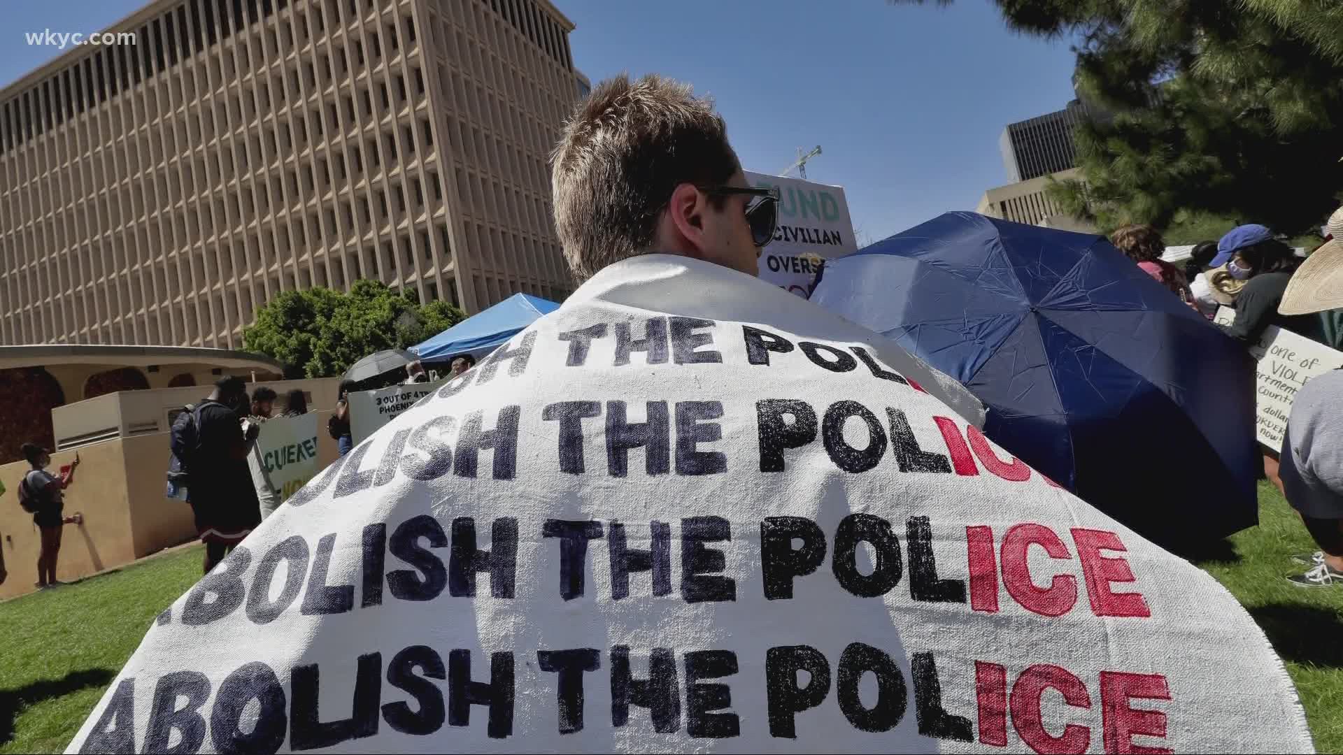 Activists say the slogan a range of meanings, including shifting money in the police budget to programs to address economic and social problems. Mark Naymik explains