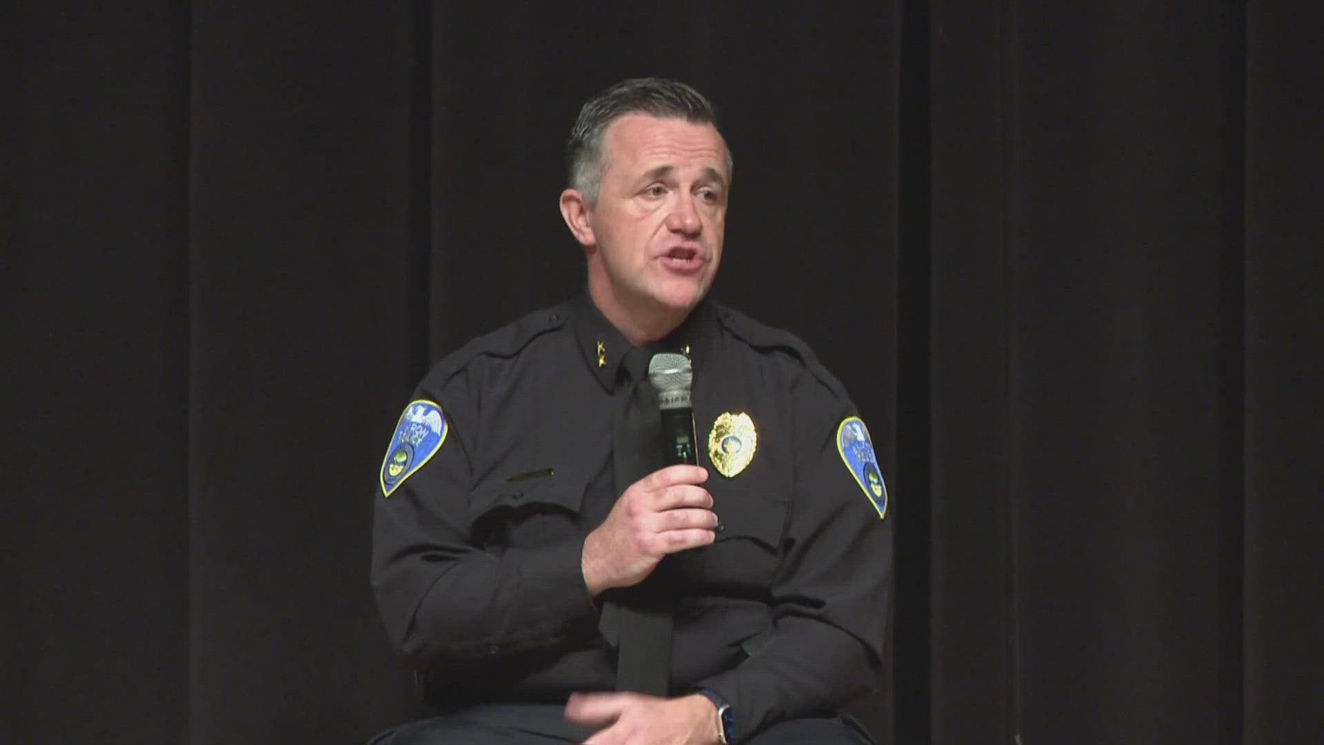 The final candidate for Akron's police chief was in the hot seat Saturday as residents voiced concerns and peppered Brian Harding with questions at a town hall event