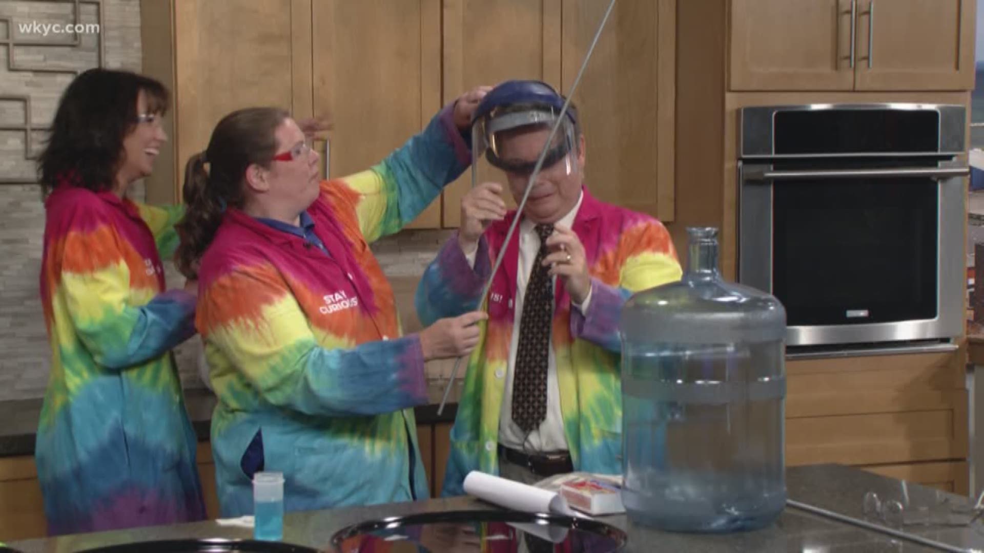 Jim Donovan and Betsy Kling learn about hydrogen as a fuel for rockets courtesy of the Great Lakes Science Center