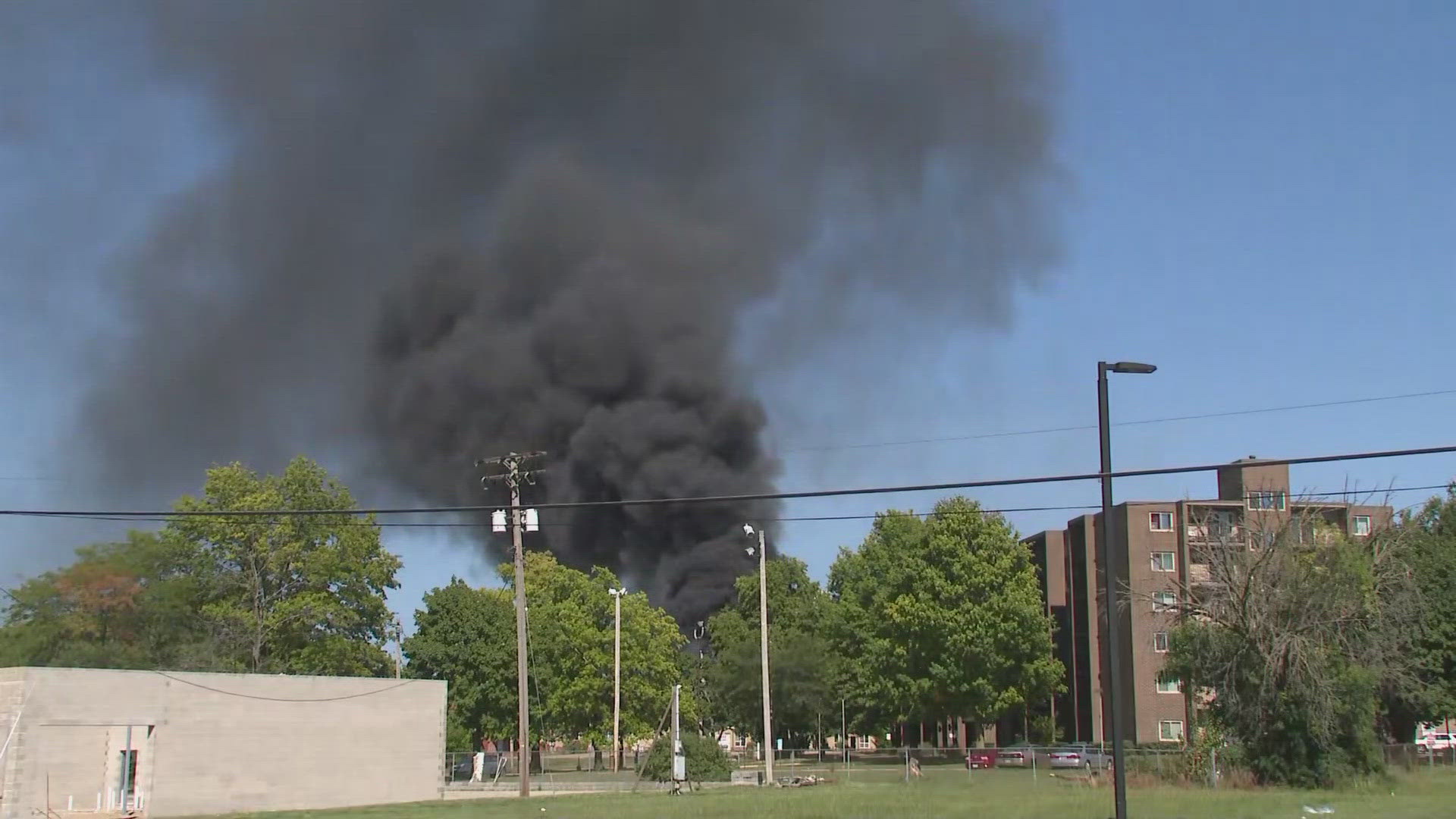 Akron city officials say the building 'contains chemicals which are burning and creating an unsafe hazmat situation.'