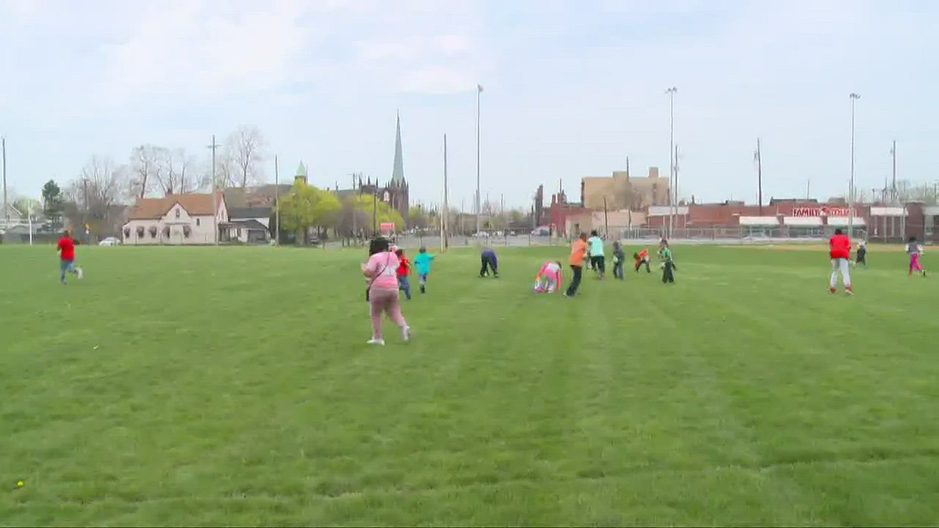 Children from the Boys and Girls Club of Cleveland hunt for easter eggs.