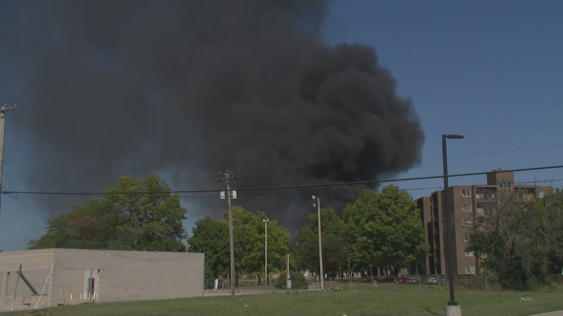 Akron city officials say the building 'contains chemicals which are burning and creating an unsafe hazmat situation.'